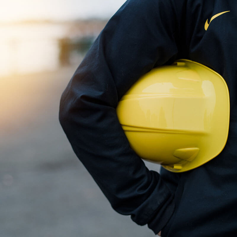 construction worker holding hard hat